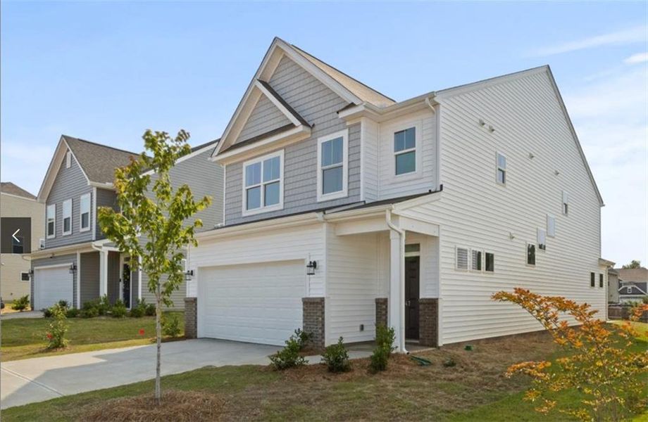 Front exterior of a new home in Villas at Dawsonville, Dawsonville, GA, highlighting curb appeal (Image 13). Front exterior of a new home in Villas at Dawsonville, Dawsonville, GA, highlighting curb appeal (Image 13).