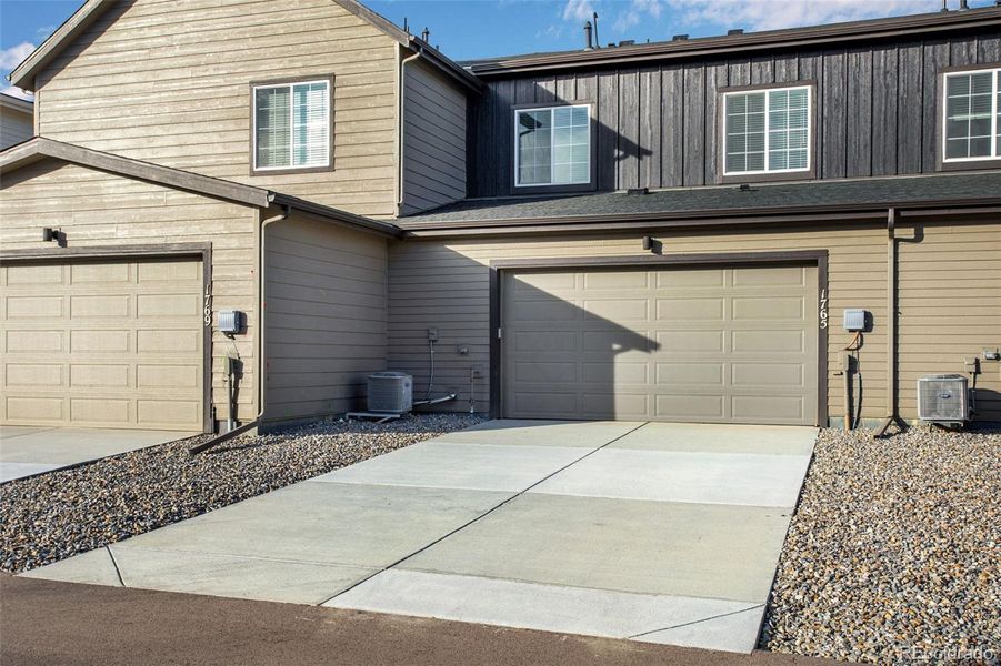 Exterior details and patio area of a home in Westside Crossing Townhomes, Berthoud (Image 3).
