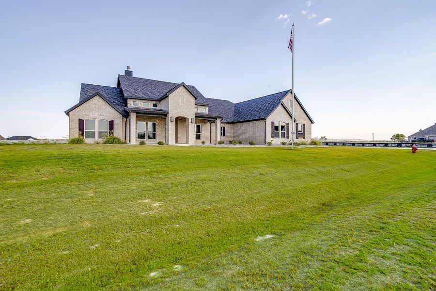 Front exterior of a new home in Rocky Top Ranch, Reno, TX, highlighting curb appeal (Image 28). Front exterior of a new home in Rocky Top Ranch, Reno, TX, highlighting curb appeal (Image 28).