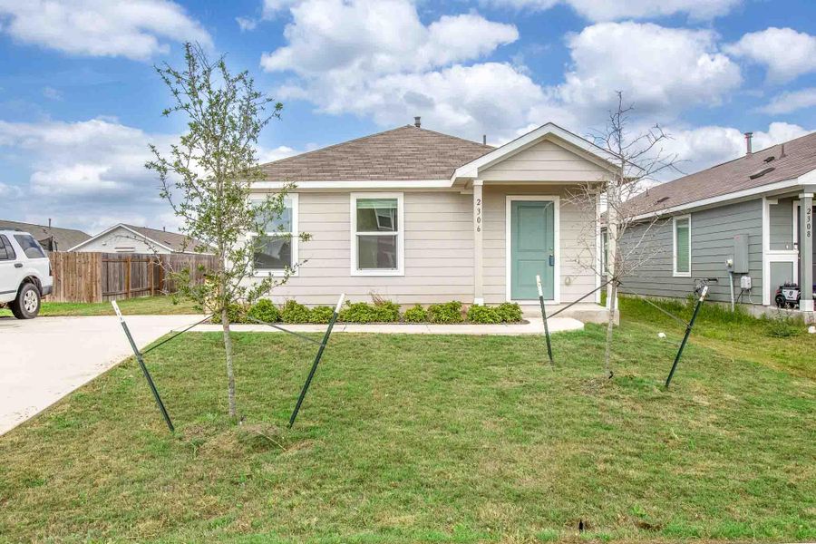 Front exterior of a new home in Summerside, Lockhart, TX, highlighting curb appeal (Image 15).