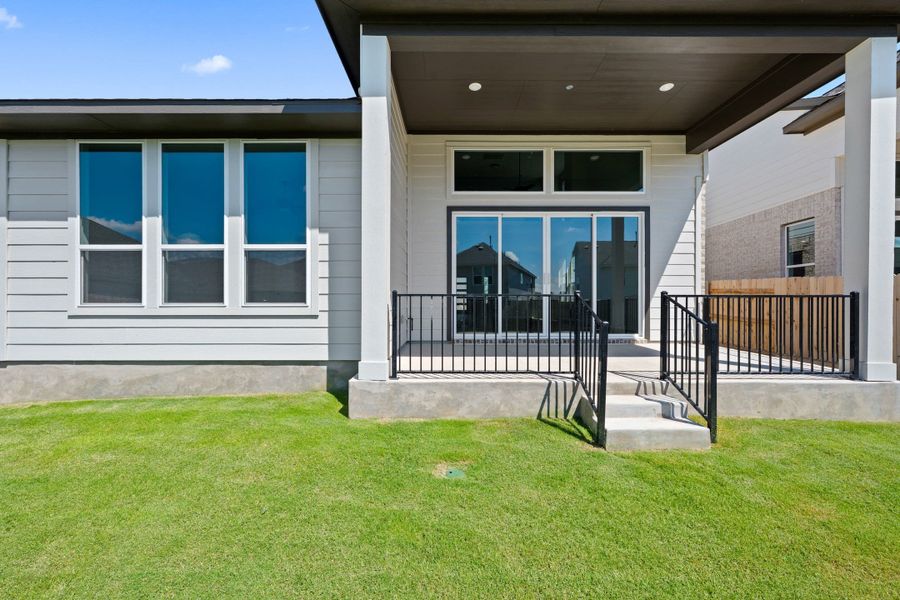 Exterior details and patio area of a home in Lariat, Liberty Hill (Image 26).