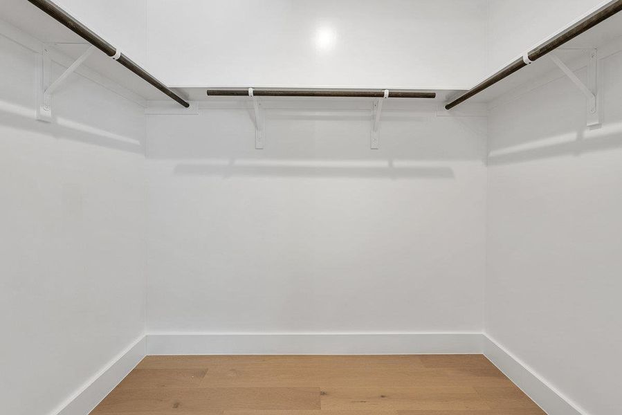 Spacious, unfurnished interior of a new home in Milky Way at River Place, Austin (Image 36).