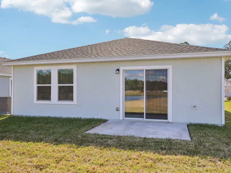 Exterior details and patio area of a home in Flagler Village - Classic Series, Palm Coast (Image 2). Exterior details and patio area of a home in Flagler Village - Classic Series, Palm Coast (Image 2).