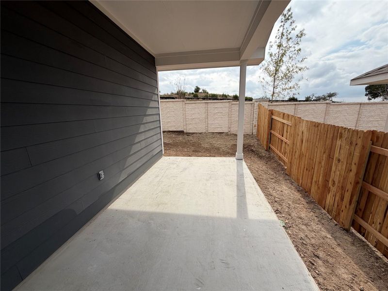 Exterior details and patio area of a home in Cannon Ranch 40s, Dripping Springs (Image 16).