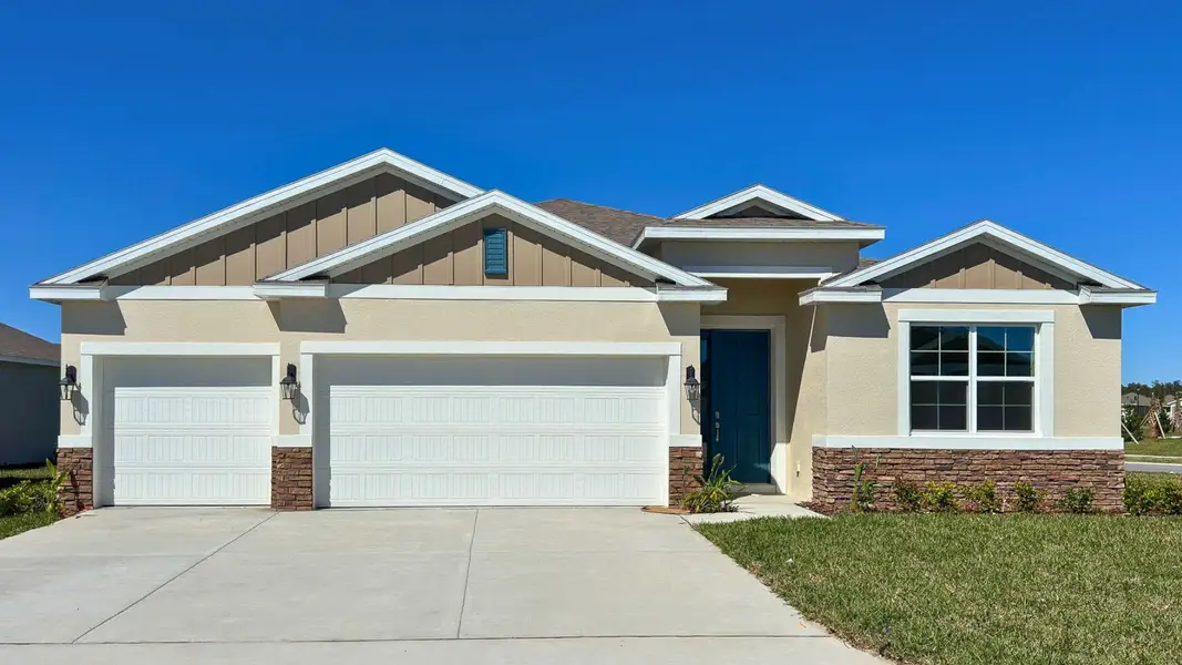Front exterior of a new home in Archers Mill, Ormond Beach, FL, highlighting curb appeal (Image 1). Front exterior of a new home in Archers Mill, Ormond Beach, FL, highlighting curb appeal (Image 1).