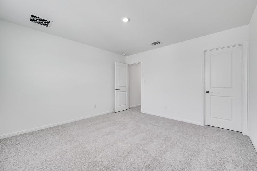 Representative unfurnished interior of a home built from the Wren by Taylor Morrison in Turner's Crossing 50s, Austin (Image 19).