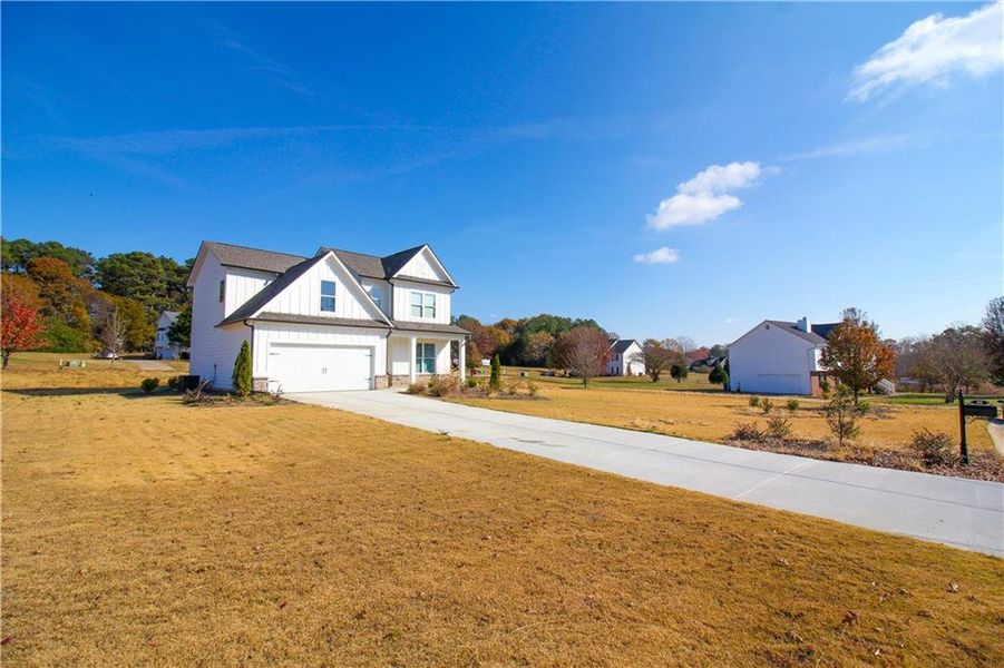 Front exterior of a new home in , Commerce, GA, highlighting curb appeal (Image 17).