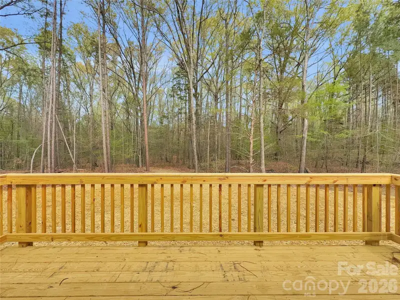 Large deck overlooking wooded back yard Large deck overlooking wooded back yard