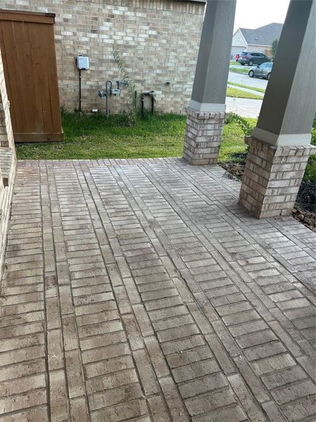 View of the wide front porch. That has been brick covering it! View of the wide front porch. That has been brick covering it!