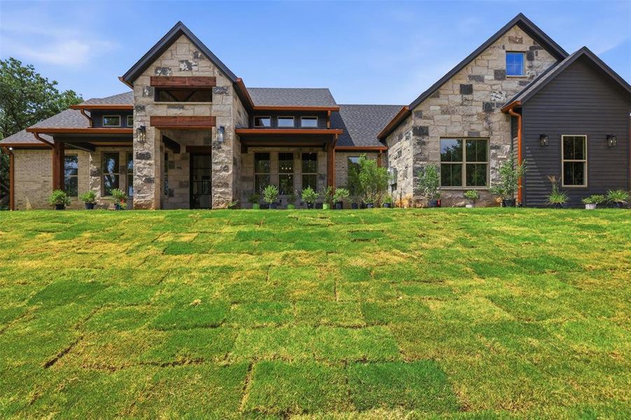 Front exterior of a new home in , Granbury, TX, highlighting curb appeal (Image 1). Front exterior of a new home in , Granbury, TX, highlighting curb appeal (Image 1).
