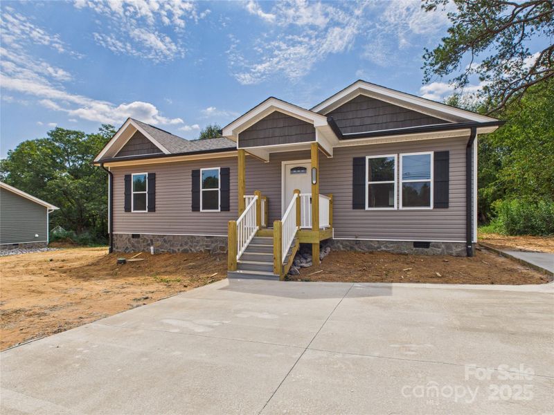 Front exterior of a new home in , Connelly Springs, NC, highlighting curb appeal (Image 1). Front exterior of a new home in , Connelly Springs, NC, highlighting curb appeal (Image 1).