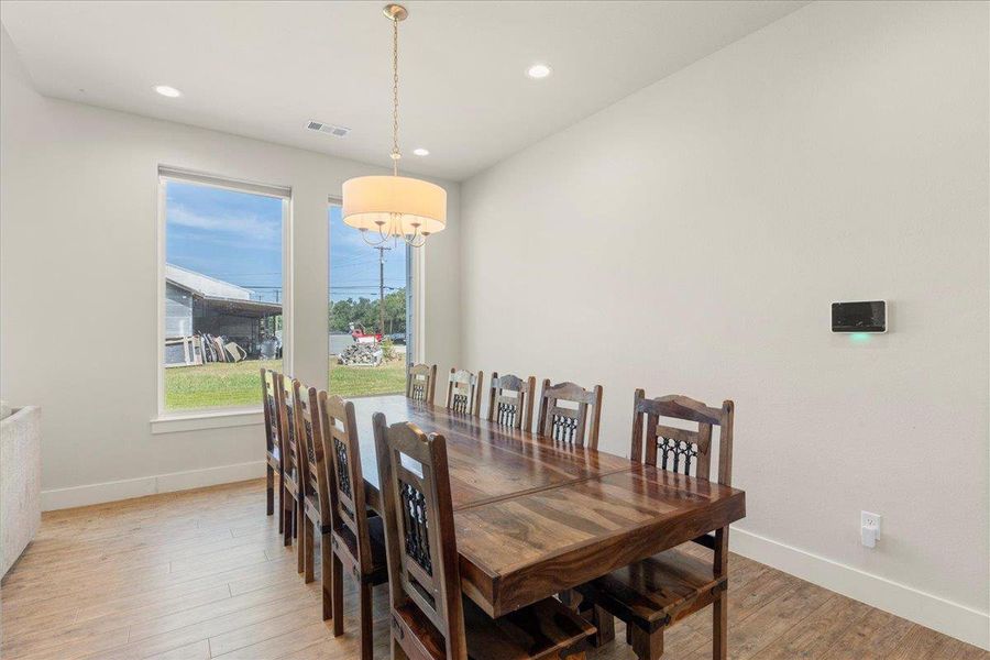 Dining space featuring light wood finished floors and recessed lighting Dining space featuring light wood finished floors and recessed lighting