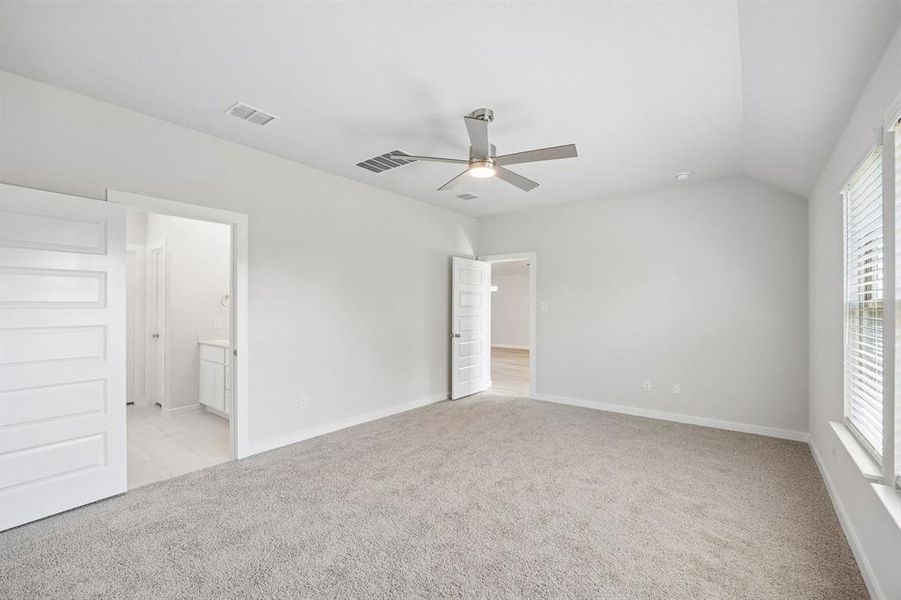Primary Suite in the Oscar home plan by Trophy Signature Homes – REPRESENTATIVE PHOTO