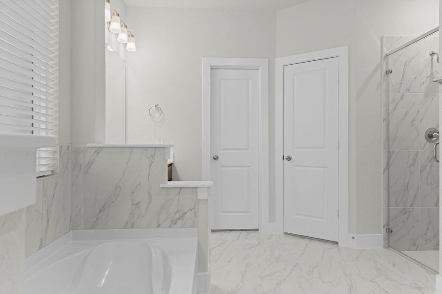 The bathroom also features a separate glass-enclosed shower, creating the perfect balance of style and function for your daily routine. The bathroom also features a separate glass-enclosed shower, creating the perfect balance of style and function for your daily routine.