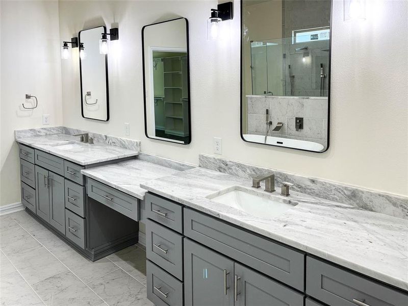 Bathroom featuring tile floors and vanity