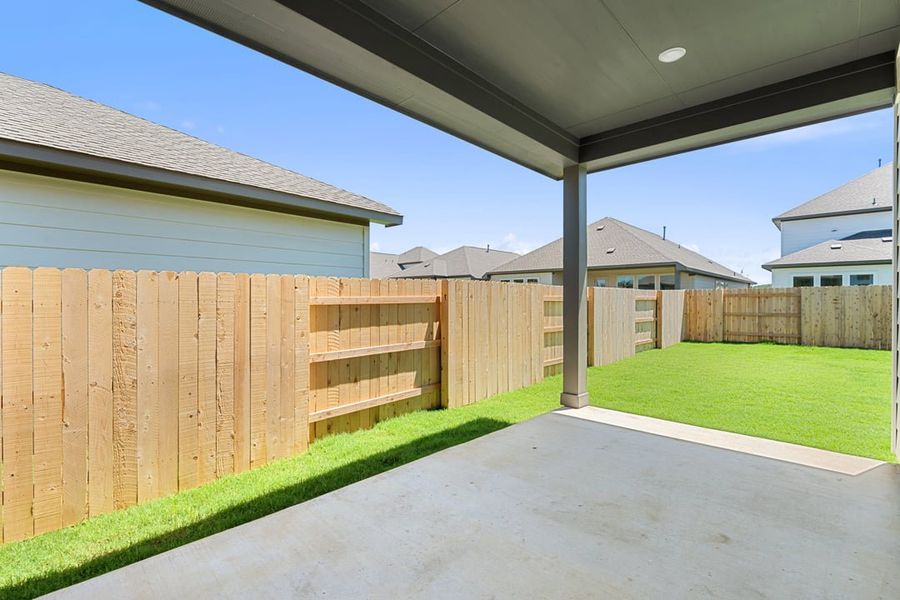 Front exterior of a new home in Lagos Reserve, Manor, TX, highlighting curb appeal (Image 23). Front exterior of a new home in Lagos Reserve, Manor, TX, highlighting curb appeal (Image 23).