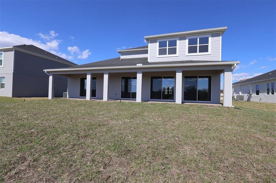 Exterior details and patio area of a home in Wolf Lake Ranch, Apopka (Image 3).