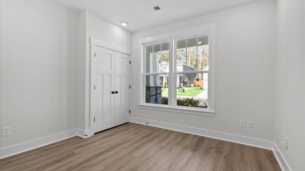 Desirable hardwood flooring in all bedrooms creates a cohesive and elegant interior Desirable hardwood flooring in all bedrooms creates a cohesive and elegant interior