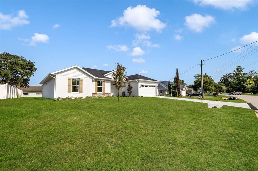 Front exterior of a new home in , Palm Coast, FL, highlighting curb appeal (Image 32).
