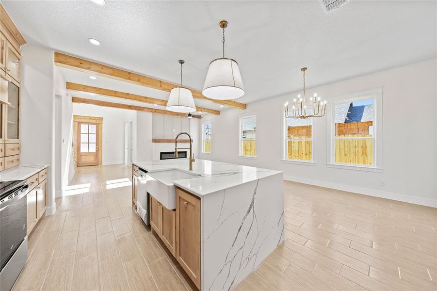 Kitchen featuring wood finish floors, light stone countertops, glass fronted cabinets, stainless steel range with electric stovetop, and beam ceiling Kitchen featuring wood finish floors, light stone countertops, glass fronted cabinets, stainless steel range with electric stovetop, and beam ceiling