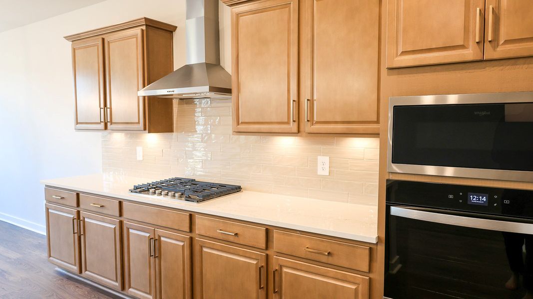 Representative furnished interior of a home built from the STONEBROOK II by D.R. Horton in Harvest Point, Spring Hill (Image 9).