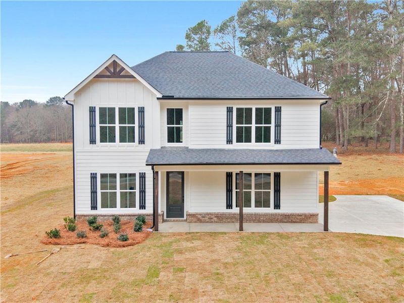 Front exterior of a new home in , Mansfield, GA, highlighting curb appeal (Image 20).