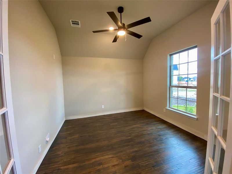 Study with French doors, wood floors, and ceiling fan.