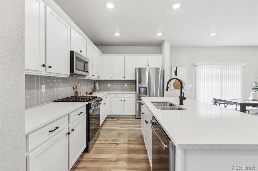 Furnished interior view inside a new home in Woodrose at Painted Prairie, Aurora (Image 9).