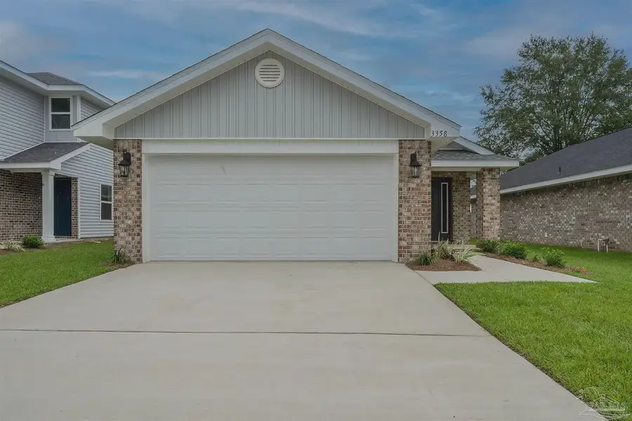 Front exterior of a new home in Allison Acres, Cantonment, FL, highlighting curb appeal (Image 1).