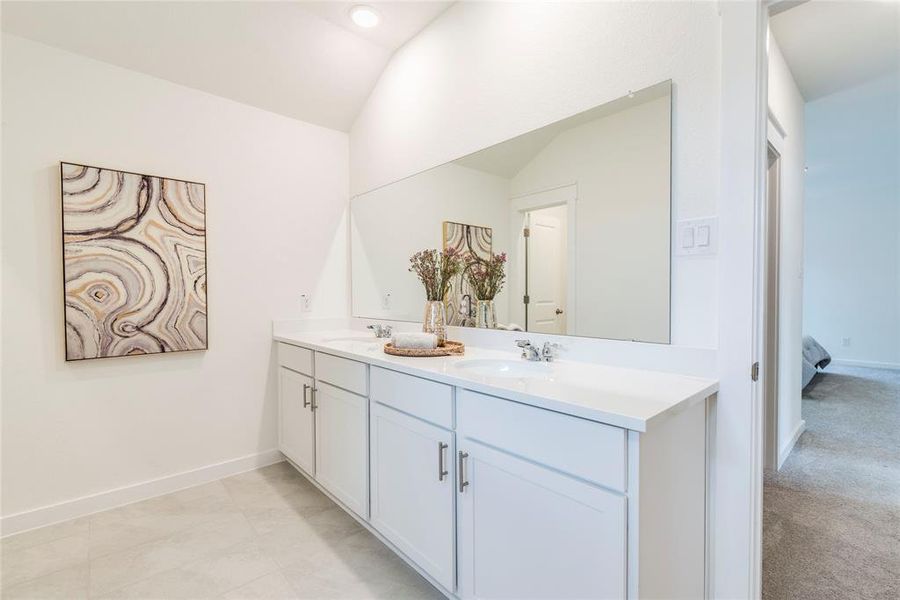 Large ensuite bath with oversized tiled shower makes this primary bath a treat!