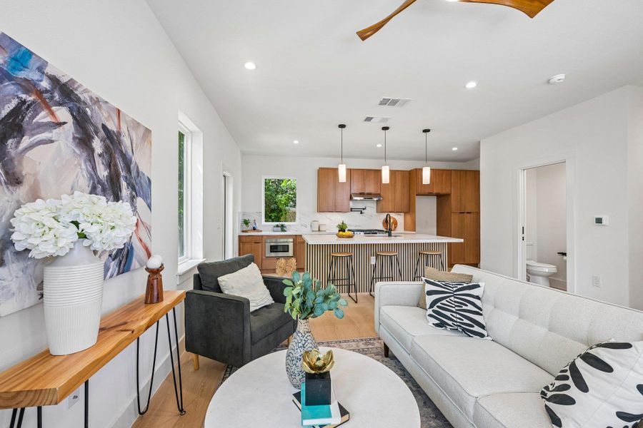 An open-concept living space integrates a thoughtful kitchen, ideal for entertaining. An open-concept living space integrates a thoughtful kitchen, ideal for entertaining.