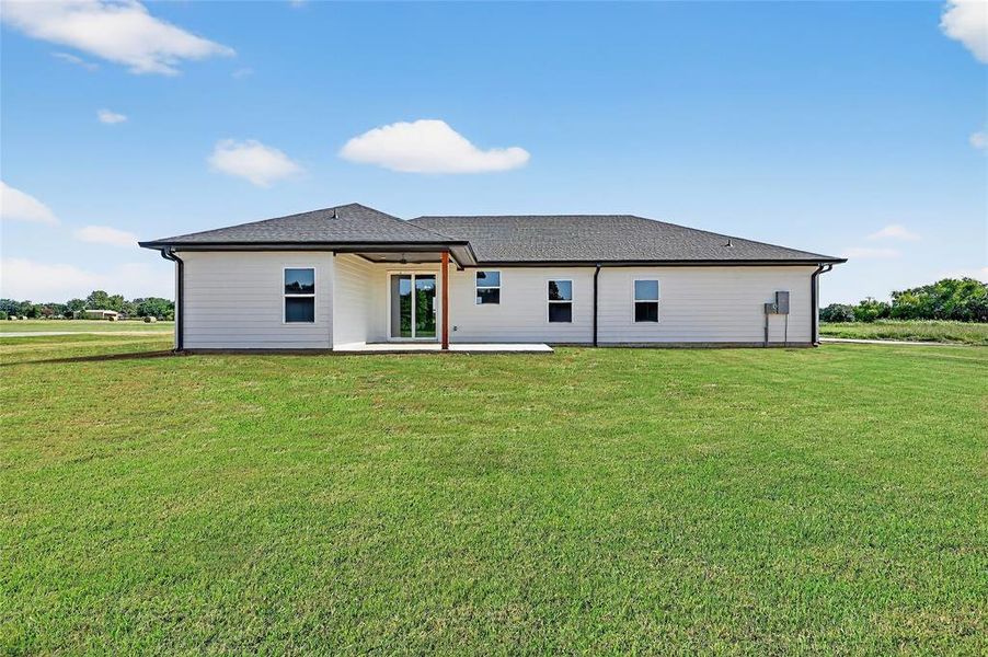 Front exterior of a new home in , Sadler, TX, highlighting curb appeal (Image 24). Front exterior of a new home in , Sadler, TX, highlighting curb appeal (Image 24).