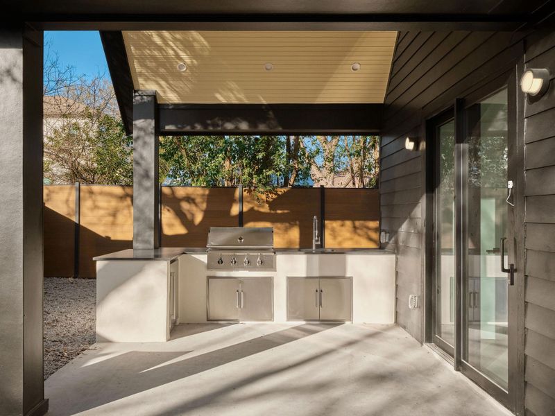 View of patio featuring an outdoor kitchen