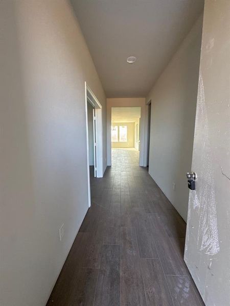 Hall featuring dark wood-style floors