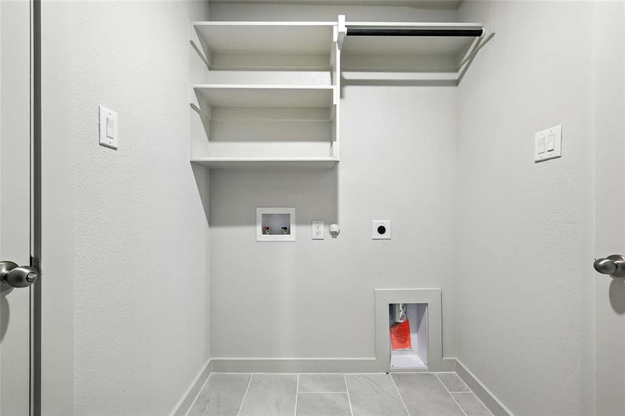 Washroom featuring hookup for an electric dryer, washer hookup, and gas dryer hookup Washroom featuring hookup for an electric dryer, washer hookup, and gas dryer hookup