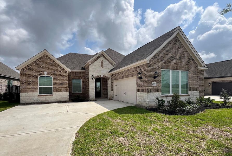 Front exterior of a new home in Sierra Vista, Iowa Colony, TX, highlighting curb appeal (Image 1). Front exterior of a new home in Sierra Vista, Iowa Colony, TX, highlighting curb appeal (Image 1).