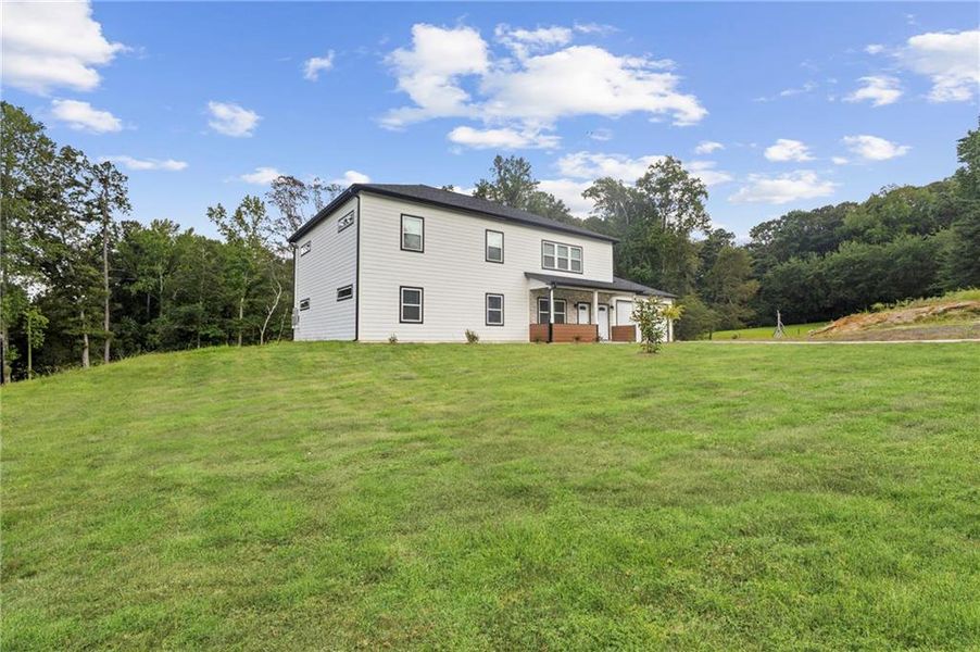 Front exterior of a new home in , Sugar Hill, GA, highlighting curb appeal (Image 17).