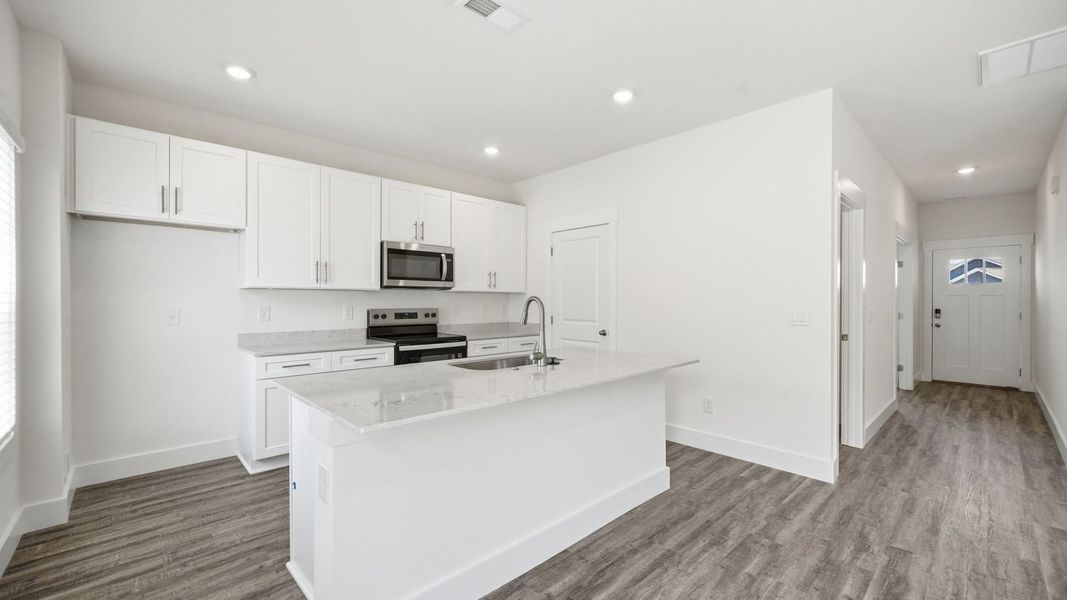 Furnished interior view inside a new home in The Hideaway at Fox Meadows, Bluff City (Image 4).