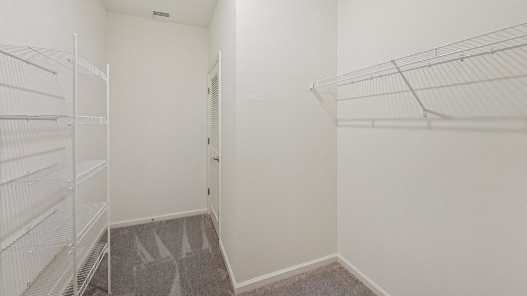 The Fleetwood Floor Plan Primary Suite walk-in closet by DRB Homes in Panther Creek New Jacksonville Home Community