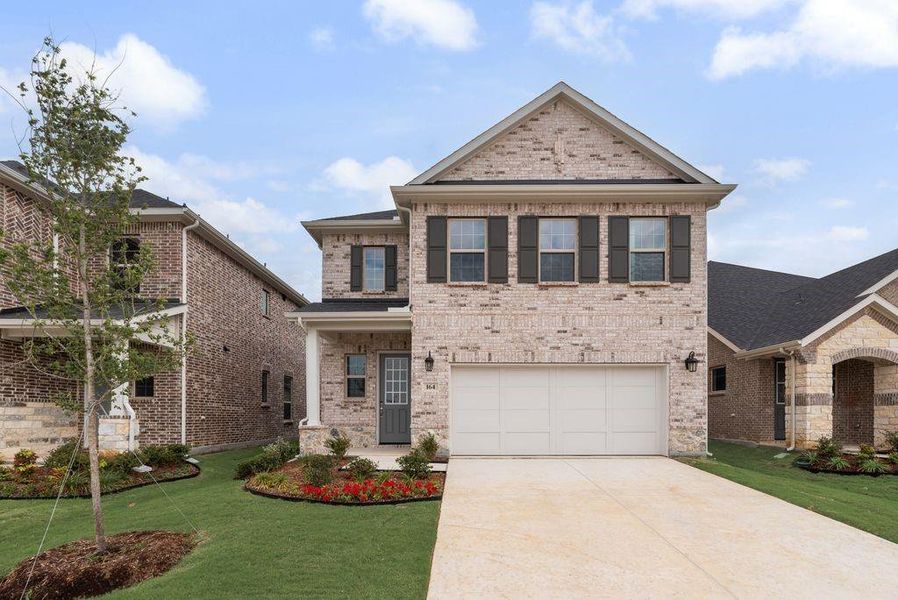 Front exterior of a new home in Spiritas Ranch, Little Elm, TX, highlighting curb appeal (Image 20).