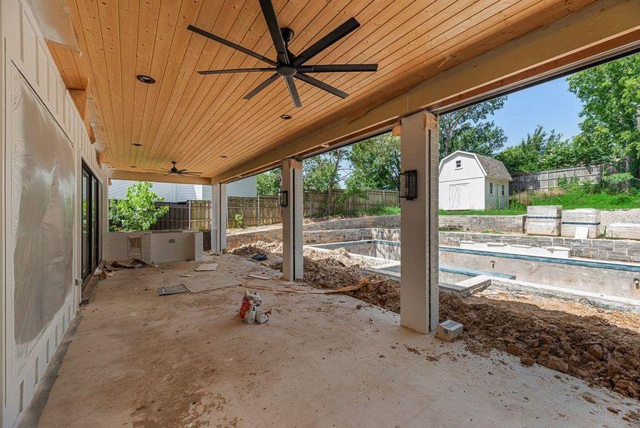 Huge back patio with outdoor kitchen and screens to enclose it Huge back patio with outdoor kitchen and screens to enclose it