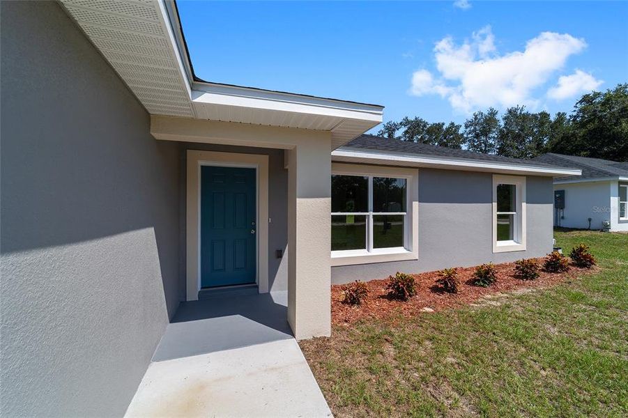 Front exterior of a new home in , Dunnellon, FL, highlighting curb appeal (Image 2).