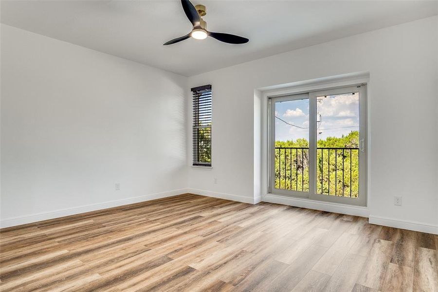 Spare room featuring light wood-type flooring and ceiling fan