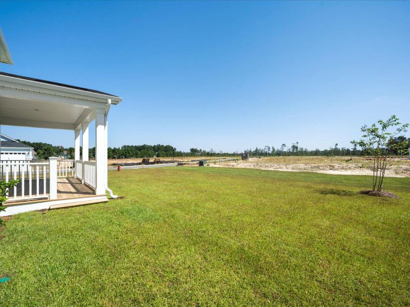 Exterior details and patio area of a home in The Coves at Lakes of Cane Bay, Summerville (Image 15). Exterior details and patio area of a home in The Coves at Lakes of Cane Bay, Summerville (Image 15).