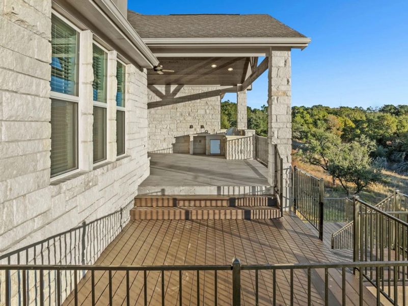 Deck with a patio area and exterior kitchen Deck with a patio area and exterior kitchen