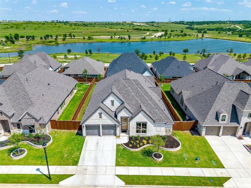 Aerial view of residential area with a nearby body of water Aerial view of residential area with a nearby body of water