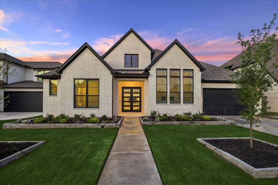 Front exterior of a new home in , Fulshear, TX, highlighting curb appeal (Image 22). Front exterior of a new home in , Fulshear, TX, highlighting curb appeal (Image 22).