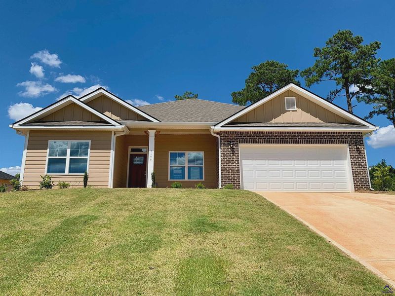 Front exterior of a new home in Barrington Place, Macon, GA, highlighting curb appeal (Image 1).