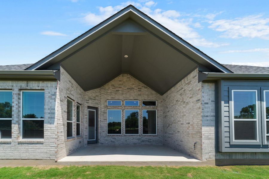 A spacious covered patio provides an ideal setting for outdoor entertaining and relaxation.