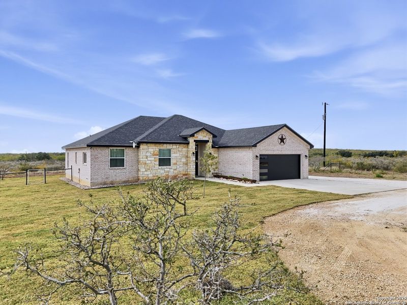 Front exterior of a new home in , Uvalde, TX, highlighting curb appeal (Image 23).